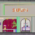 SKRENI Storefront Design With White Facade Orange Signage Arched Entrance And Potted Plant