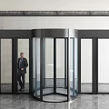 Modern Commercial Building Revolving Door With Glass Panels Metal Frame And Marble Walls