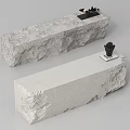Rock Textured Stone Reception Desk With Light Gray Surface And Decorative Ornaments