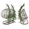 Wicker Hanging Chair With Cushions Blanket And Ivy Plants