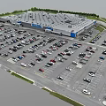 Aerial View of Large Retail Store Parking Lot Full of Cars and Green Surroundings