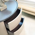 Beige Dresser With Round Top Two Drawers In Living Room With Curtains And Sofa