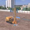 Industrial Drilling Rig At Construction Site With High Rise Buildings Traffic Cones And Blue Signage
