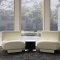 Beige Casual Sofa Set With Modern Minimalist Design And Small Coffee Table By Large Windows With Green Trees View