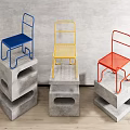 Colorful Metal Frame Leisure Chairs On Concrete Pedestals Against Grey Wall Wooden Floor