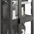 Modern Dark Wood Display Cabinet With Glass Doors Holding Vases Candles And Books
