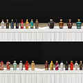 Colorful Wine Bottles And Wine Glasses Arranged On White Shelves With Black Background