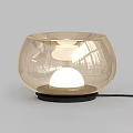 Modern Transparent Glass Table Lamp With Bowl Shaped Design And Black Base Illuminated Sphere
