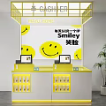 Yellow Checkout Counter With Smiley Faces Background Numbered Screens And Green Plant At MAYU HOME