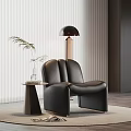 Modern Black Leather Leisure Chair With Side Table Green Plant Floor Lamp On Rug