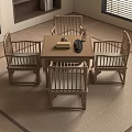 Natural Wood Tea Table and Chairs with Teapot Books on Living Room Rug
