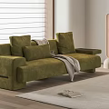Green Velvet Double Sofa With Pillows And Blanket On Wooden Floor Near Roller Blinds