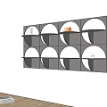 Modern Minimalist Black Wall Mounted Shelf With Circular Compartments And Decor Pieces