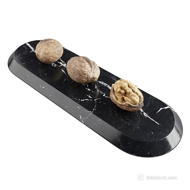 Whole And Cracked Walnuts On Black Marble Tray With Visible Kernel 3d model