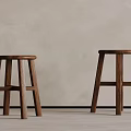 Two Wooden Stools With Simple Design Against Light Wall And Floor Background 3d model