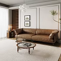 Brown Leather Sofa and Round Wooden Coffee Table Set in Living Room with Decorative Paintings