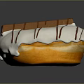 Delicious Donut With White Frosting Brown Stripes And Chocolate Stick Decoration