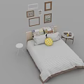 Double Bed with Striped Bedspread Decorative Pillows Side Tables and Wall Frames in Bedroom 3d model
