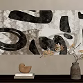 Abstract Painting With Black Irregular Shapes And White Textured Background On Wall With Decorative Vase