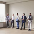 Group of men standing by wall with laptop and documents near window with blinds