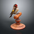 Red Headed Bird With Yellow And Black Feathers Perched On Wooden Stand With Circular Base