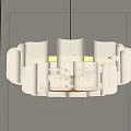 Modern White Chandelier With Wavy Petal Design Hanging In Gray Room With Soft Light