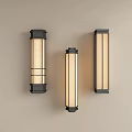 Three Modern Vertical Wall Lamps With Black Frame And Cream Shade