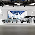 Modern Exhibition Booth Displaying New Energy Vehicles With Large Screen And Lighting