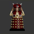Red Metallic Robot Figure With Gold Spherical Bumps And Protruding Arm