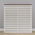 White Multi Layer Bookshelf With Brown Top Against Gray Wall And Wooden Herringbone Floor