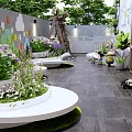 Garden Courtyard Design With White Curved Flower Beds Green Plants And Children Play Area