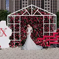 Romantic Outdoor Photo Check-in Spot With Rose Covered Wall White Frame And Red Bench