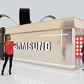 Mobile Digital Products Showcase In Modern Gift Box Shaped Booth With Black Ribbon Bow