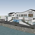Modern Waterfront Guesthouse Building With Stone Wall Green Plants Trees Balconies And Scenic View