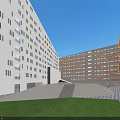 Modern Office Complex With Geometric White Orange Facades Central Courtyard Green Lawn And Blue Sky