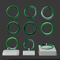 Multiple Elegant Green Jade Bracelets Displayed On White Jewelry Stands