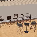 Various Stylish Bar Stools Displayed In Modern Showroom With Wooden Floor And People Seating