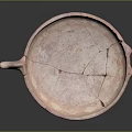 Pink Terracotta Sculpted Plate with Cracked Surface Dual Animal Head Handles and Geometric Diamond Patterns
