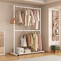 Double Layer Metal Clothes Rack With Light Colored Garments Storage Boxes And Wall Decor
