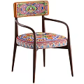 Vibrant Accent Chair With Colorful Patterned Seat Wooden Armrests And Green Throw Blanket