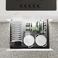 Modern Kitchen Interior Dinnerware Set Stored in Open Drawer with Plates and Bowls