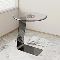 Modern Round Glass Top Side Table with Metal Base and Open Book on Marble Floor