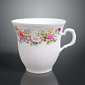 Delicate White Porcelain Cup With Colorful Floral Patterns On Body And Curved Handle