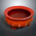 Decorative Red Ceramic Pot With Carved Leaf Patterns And Three Feet