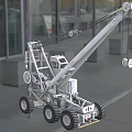 Heavy Duty Crane Utility Vehicle With Extended Arm Large Wheels And Outdoor Construction Setting
