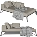 Modern Beige Chaise Lounge with Plush Pillows Checkered Blanket and Metal Legs