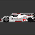 Sleek Silver Audi Race Car With Red Accents Rear Wing And Aerodynamic Design