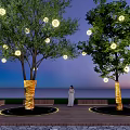 Arbor Trees With Gold Wrapped Trunks And Hanging Round Lights At Sunset By Sea View