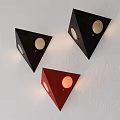 Triangular Black and Red Wall Lamps with Circular Cutouts Mounted on White Wall 3d model