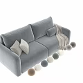 Light Beige Two Seater Sofa With Soft Upholstery Decorative Pillows And Cozy Throw Blanket